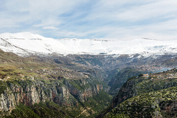 Fototapeta premium Snow capped mountains overlooking Qadisha valley, Bsharri, Lebanon