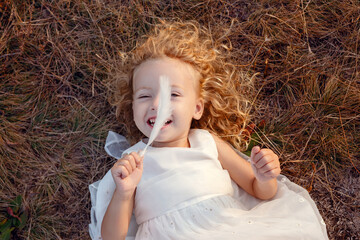 Funny  beautiful little angel girl who looks like Merlin Monroe