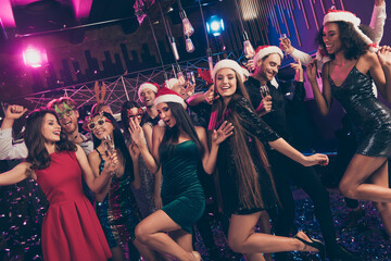 Photo of funky people careless festive mood celebrate party wear mini dress x-mas cap glasses modern club indoors