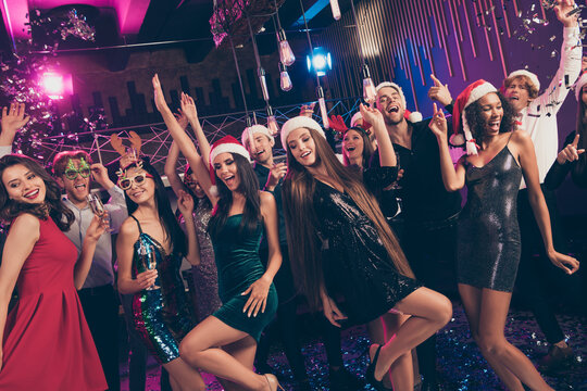 Photo of people raise hands disco classy ladies legs wear short dress x-mas headwear modern club indoors
