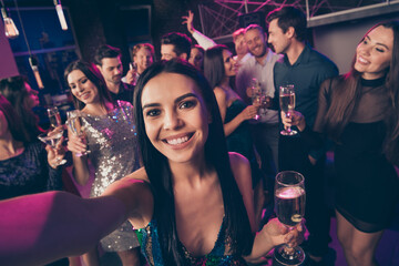 Self photo portrait of girl at party drinking champagne