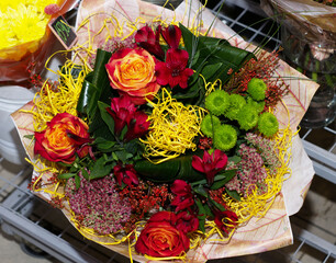 beautiful, autumn bouquet in female hands, in a flower shop. Bright, unusual bouquet, floral...