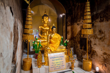 Wat Umong Suan Puthatham is a Buddhist temple in the historic centre, Buddha statue in the old cave of Wat Umong in Chiang Mai, Thailand.