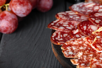 Wooden platter with meat cuts close up
