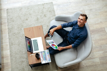 male designer choosing a color for a new project .