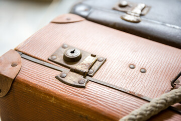 Old suitcases are tied to the frame of an old Bicycle.