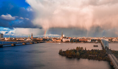 Absolutely amazing aerial shot over Riga old town, the capital of Latvia during sunny rain with a...