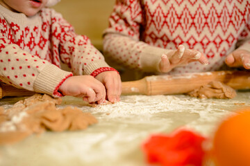 Obraz na płótnie Canvas Child hands preparing dough for Christmas cookies. Homemade baking