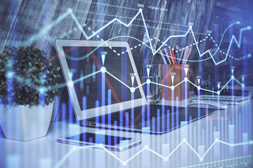 Forex market chart hologram and personal computer background. Double exposure. Concept of investment.