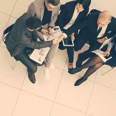 Fototapeta na wymiar top view. a group of business people discussing business documents