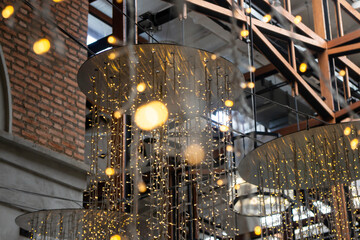 Yellow light bulbs decorated in hall ceiling
