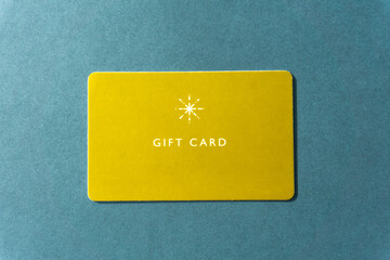 Gift card on green background. yellow gift card.
