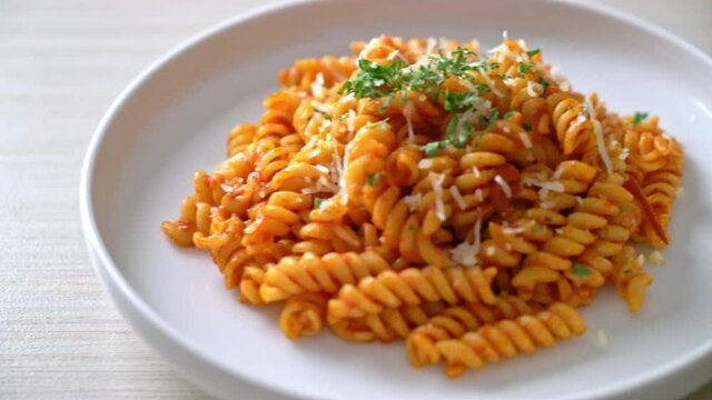 spiral or spirali pasta with tomato sauce and cheese - Italian food style