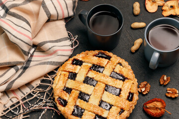 Berry tart pie on black table close up