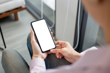 cell phone mockup blank white screen.woman hand holding texting using mobile on desk at coffee shop.background empty space for advertise.work people contact marketing business,technology