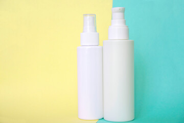 cosmetic tubes on a two-color background, empty space for text