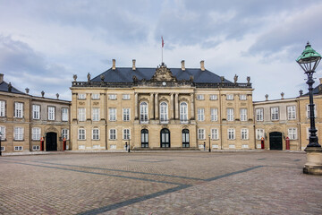Fototapeta premium Amalienborg Palace (1760) - home of the Danish royal family. Royal Palace consists of four identical classical palace facades. Copenhagen, Denmark.