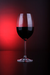 wine glass filled red and black background