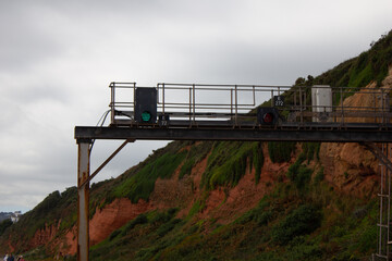 A railway signal on the seawall in Dawlish, Devon, England