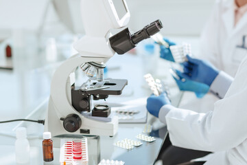 scientists work with samples of new drugs in the laboratory.