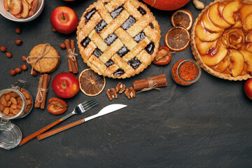 Berry tart pie and apple tart pie on black background © fotofabrika