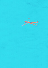 Boy floating on top of water