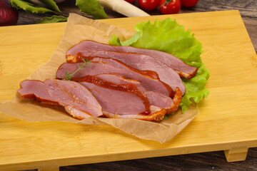 Sliced smoked duck breast served salad