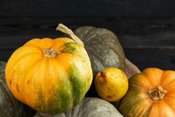 Pumpkins and pears on wooden table close-up