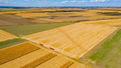 Aerial view of agricultural fields and blue sky with white clouds