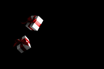 Online christmas. White gift box with red ribbon isolated on black background in Black Friday concept. Decoration and copy space for your text.