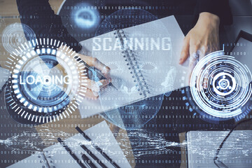 Double exposure of writing hands on background with data solution hologram on front. Technology...