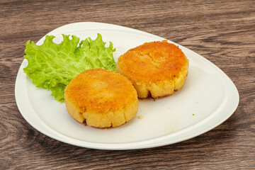 Vegan cuisine - Potato cutlet in the plate