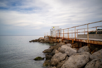 Fototapeta na wymiar Still photo of a promenade with some oxidation at Palmanova beach, in Mallorca island (Spain)