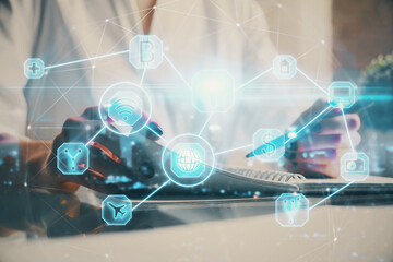 Social network theme hologram over woman's hands writing background. Concept of international people connect. Double exposure