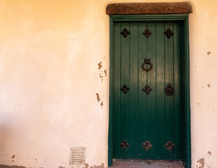 Historic adobe building with door