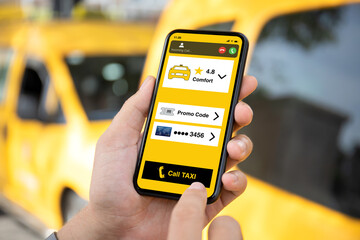 man hands holds phone with taxi call application on screen