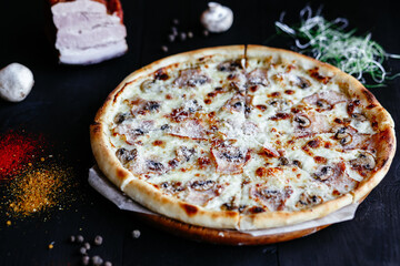 Thin pizza with mushrooms on the table