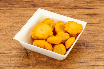 Marinated yellow patisson in the bowl