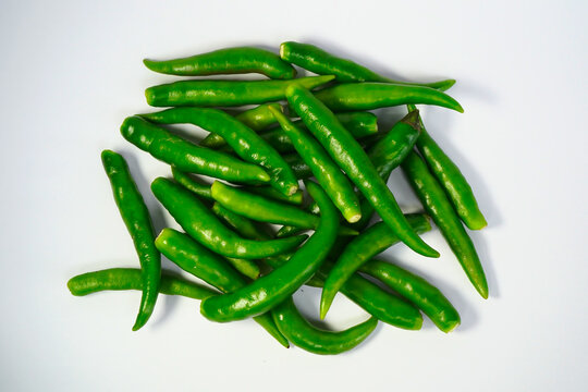 green chili peppers on white background