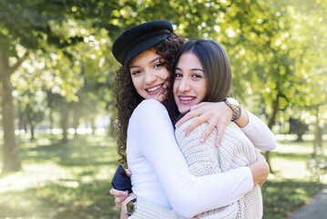 Young beautiful teenage girls    hugs 