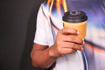 hand holding reusable eco coffee cup close up 