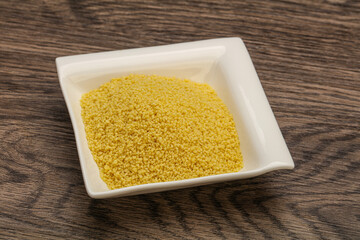 Raw cous cous heap in the bowl