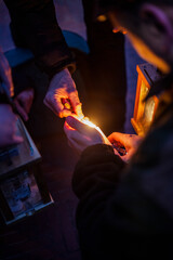 Lighting of the lantern with a match.