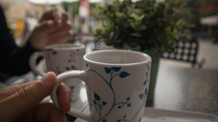 Fototapeta na wymiar Tea time break in the coffee shop