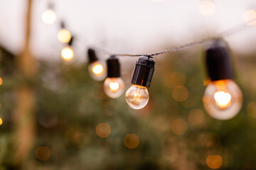 Christmas winter street with tree and festive bokeh lighting, blurred holiday background