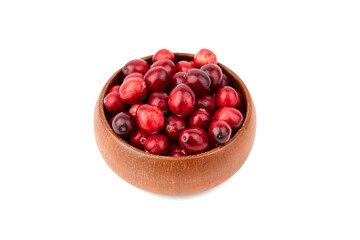 Cranberries in wooden bowl isolated on white