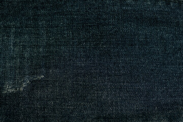 close up fabrics of dark blue jeans texture background