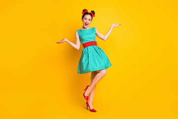 Full length body size view of nice pretty glad cheerful girl wearing teal dress dancing having fun isolated over bright yellow color background