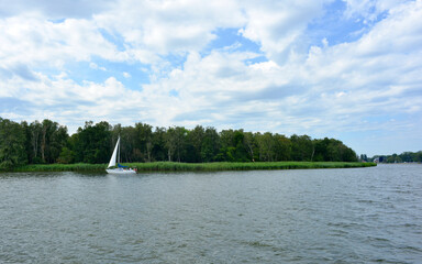 West pomerania landscape in Poland Wrzosowskie lake with sail boat in summer