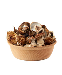 dry forest porcini mushrooms in wooden round plate